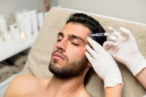 A man getting a BOTOX Cosmetic injection in his forehead