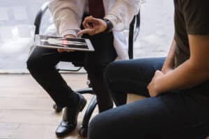 A doctor discussing UTIs with a man in Oregon