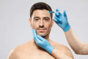 A man getting BOTOX in his forehead