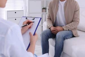A man talking to a doctor about STD testing in Eugene, OR