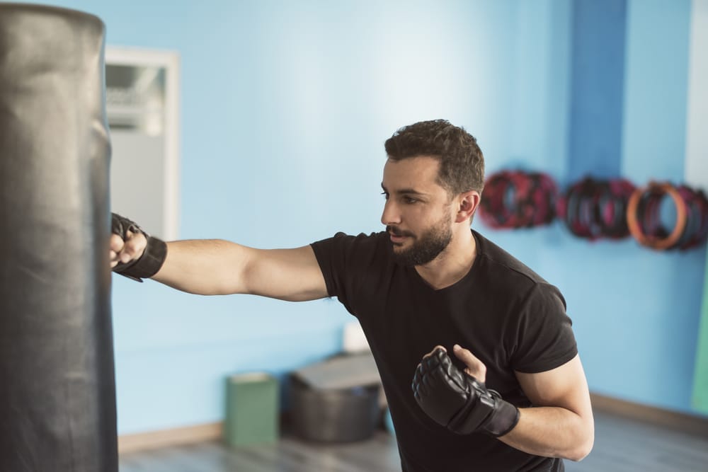 A man punching a punching bag